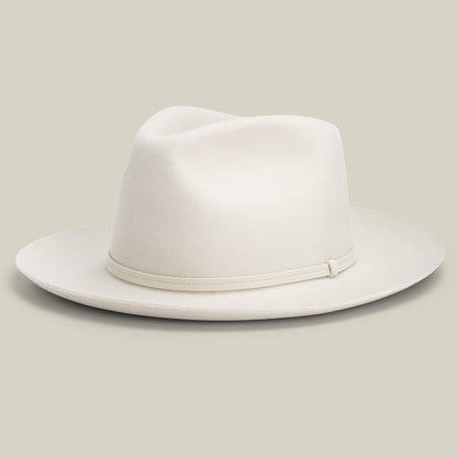 The Goorin Bros. Night Hawk is a light beige teardrop crown fedora with a wide snap brim and simple matching band, shown against a plain background.