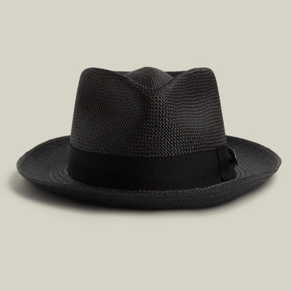 The Goorin Bros. John Sr. is a black woven toquilla teardrop fedora hat with a black ribbon band and 50 UPF sun protection, shown on a neutral background.