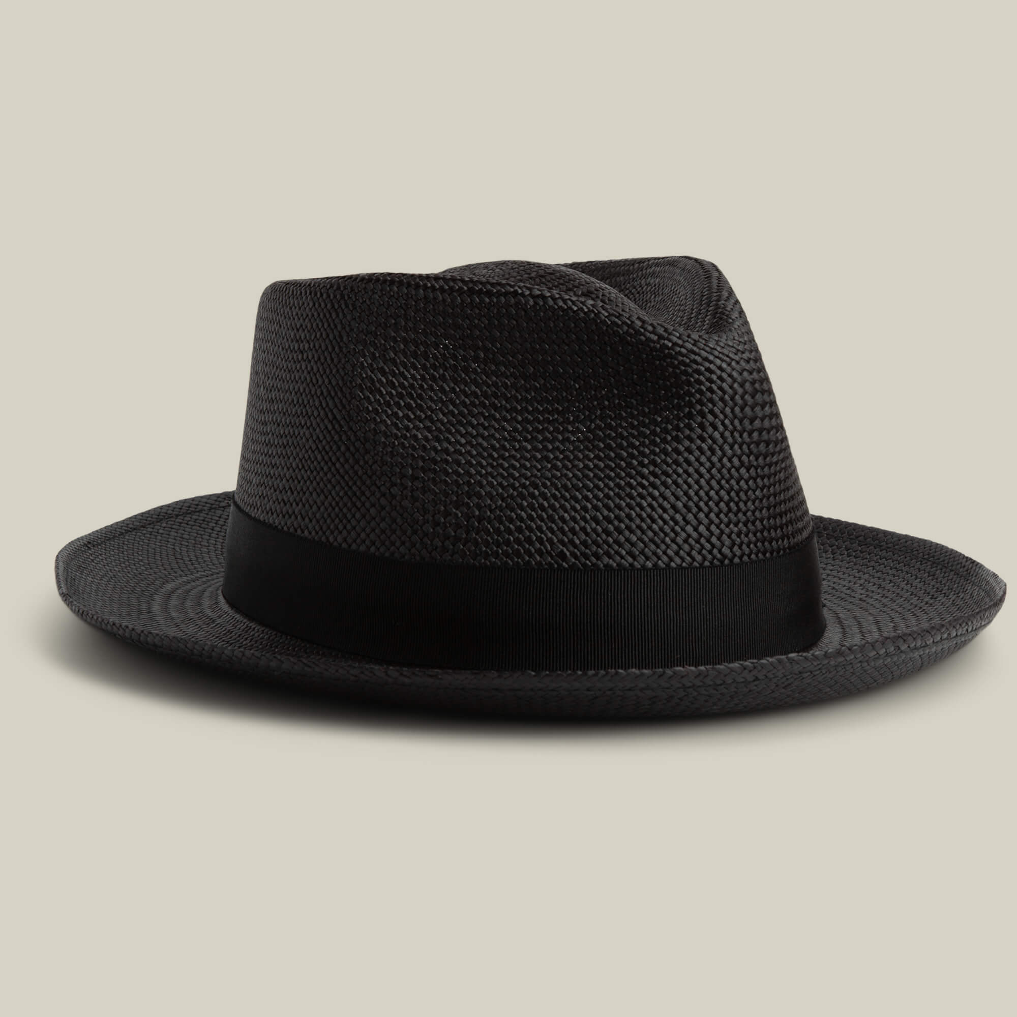 The Goorin Bros. John Sr. is a black toquilla fedora hat with a wide brim and black ribbon band, offering 50 UPF sun protection, displayed on a neutral background.