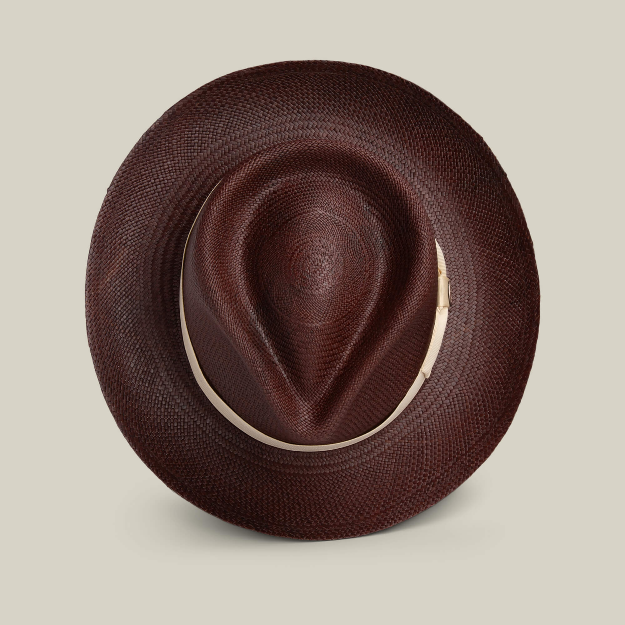 The Goorin Bros. John Sr. is a brown toquilla teardrop fedora with a wide brim and indented crown, shown from above on a light background, offering 50 UPF sun protection.