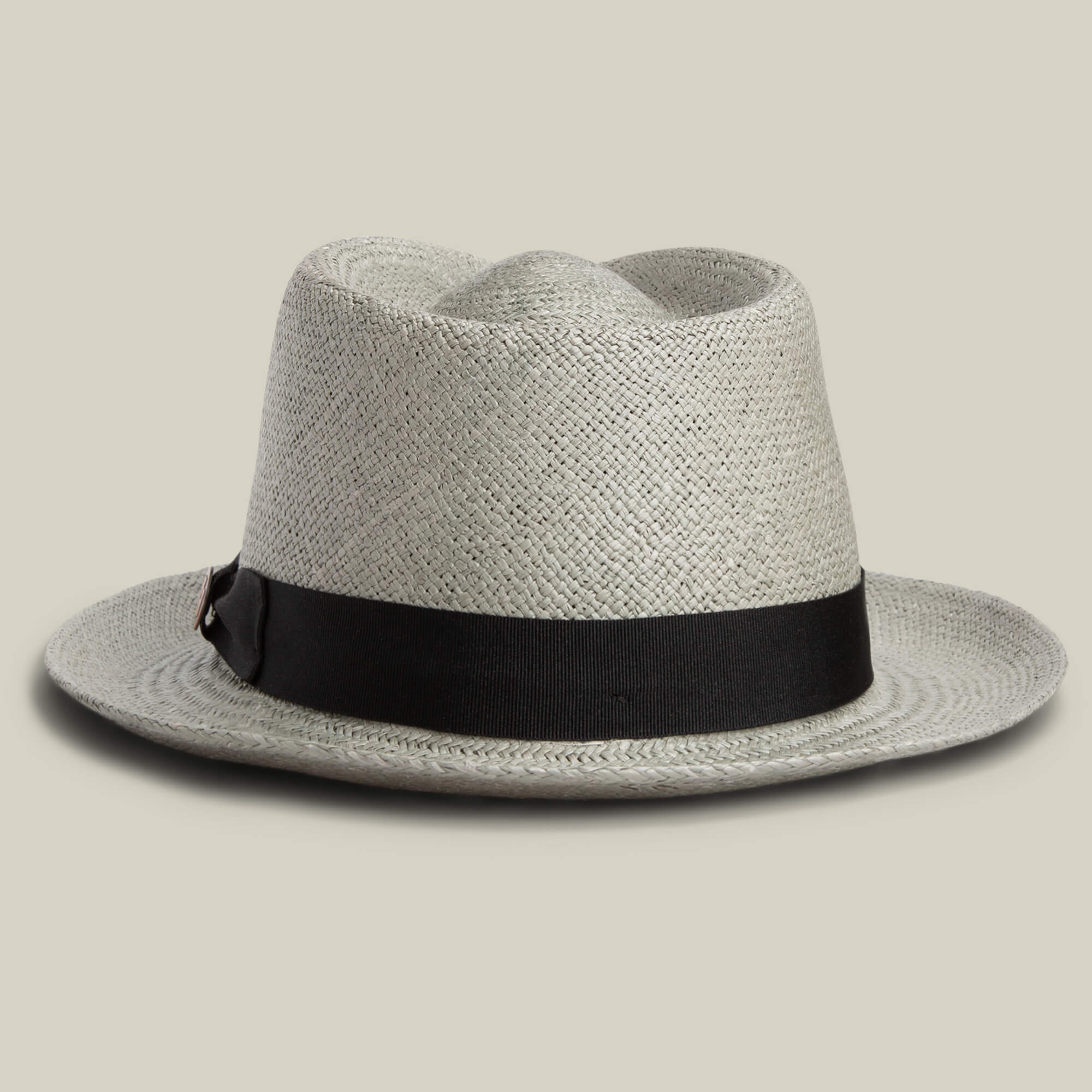 The Goorin Bros. John Sr. is a light gray toquilla teardrop fedora hat with a wide black band, offering stylish sun protection (UPF 50), shown on a neutral background.