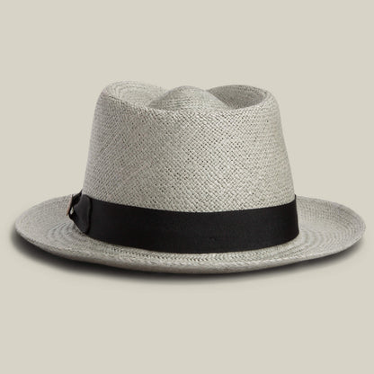 The Goorin Bros. John Sr. is a light gray toquilla teardrop fedora hat with a wide black band, offering stylish sun protection (UPF 50), shown on a neutral background.