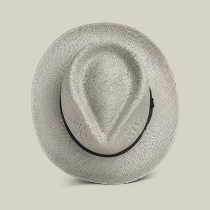 The Goorin Bros. John Sr. is a light-colored toquilla teardrop fedora with a black band, seen from above on a plain background—stylish sun protection with 50 UPF.