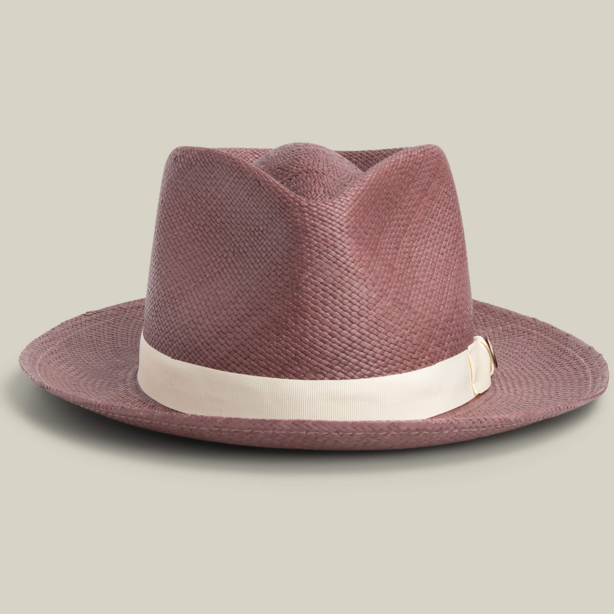 The Goorin Bros. John Sr. is a brown toquilla teardrop fedora with a wide brim, cream band, and gold buckle. It offers stylish sun protection with 50 UPF and is shown on a neutral background.