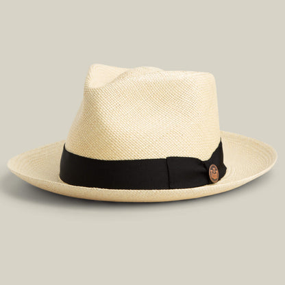 The Goorin Bros. John Sr. is a light toquilla teardrop fedora with a wide brim, black ribbon band, and side pin, offering 50 UPF sun protection for stylish days outdoors.