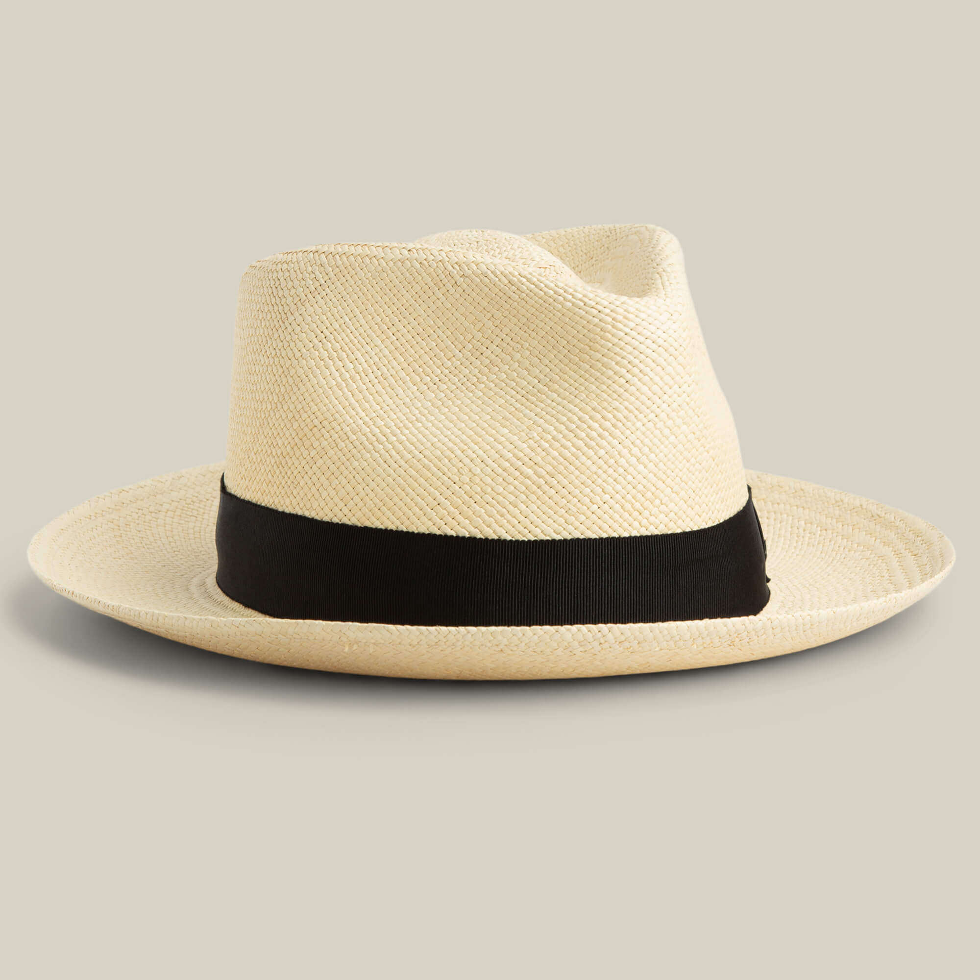 The Goorin Bros. John Sr. is a light toquilla teardrop fedora with a wide black band and 50 UPF sun protection, shown against a plain background.