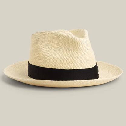 The Goorin Bros. John Sr. is a light toquilla teardrop fedora with a wide black band and 50 UPF sun protection, shown against a plain background.
