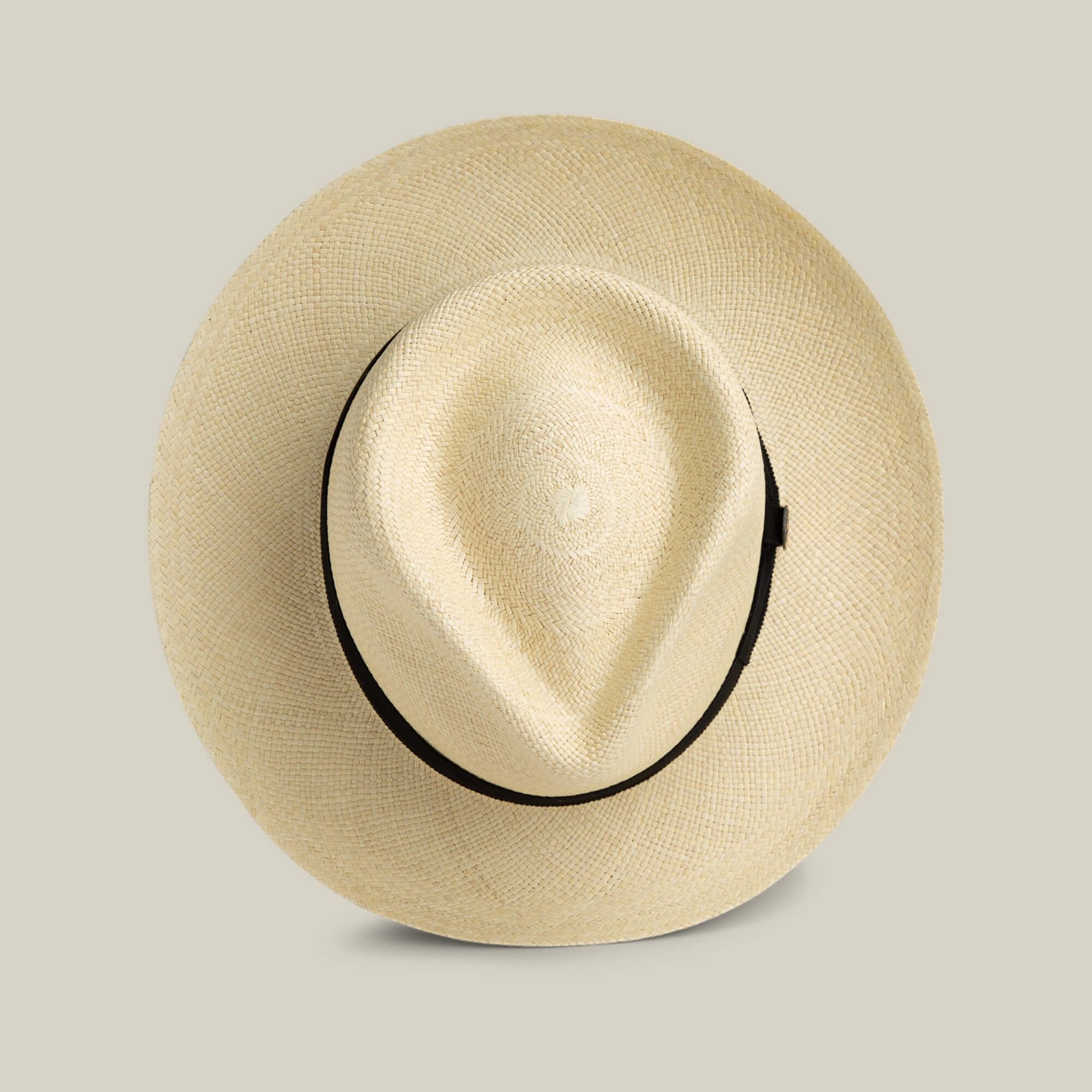 The Goorin Bros. John Sr. is a beige toquilla fedora straw hat with a black band, shown from above on a light background, providing stylish sun protection and 50 UPF.