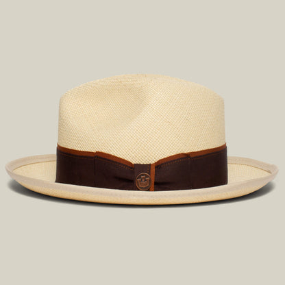 The Goorin Bros. Hartman is a light straw fedora with a wide brim, contrast edge, dark brown grosgrain band, and a small circular emblem on the front.
