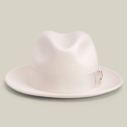 Dean the Butcher by Goorin Bros. is a cream-colored, American-made fedora with a wide brim and matching grosgrain hatband, shown against a plain light background.