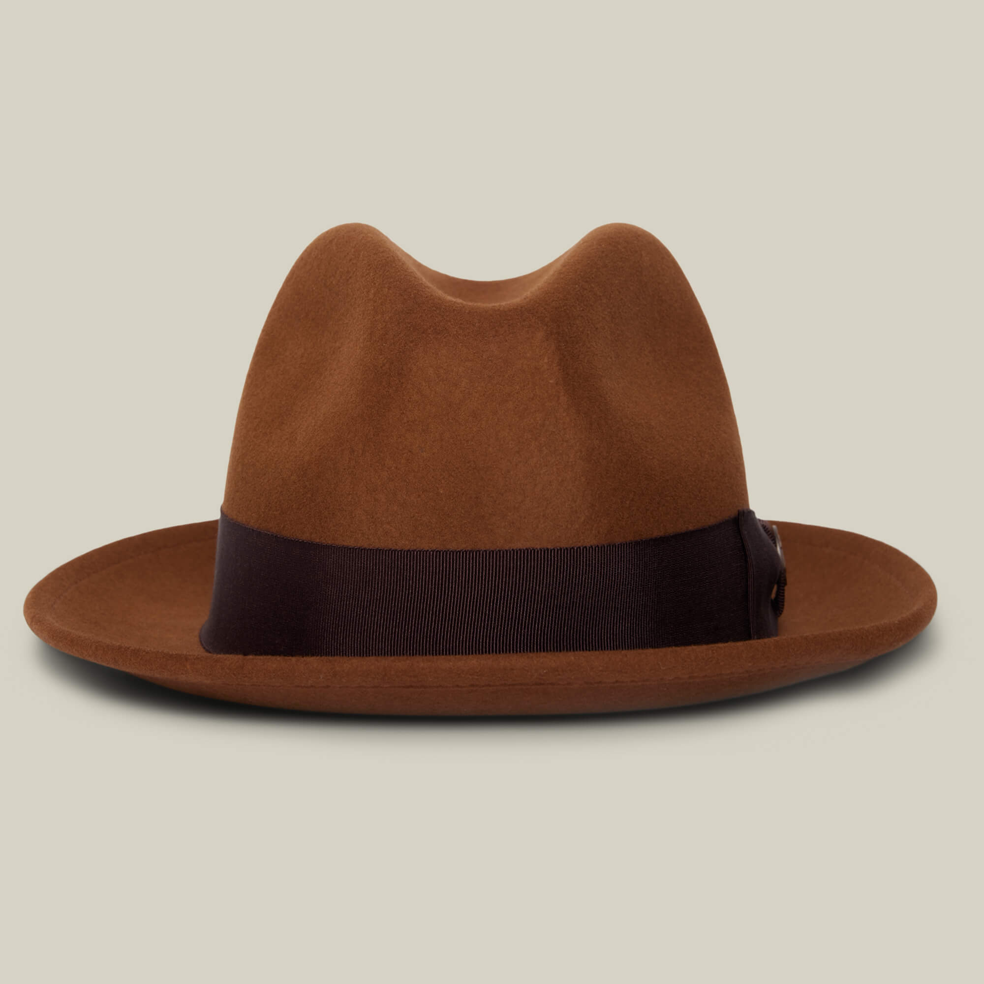 The Dean the Butcher fedora by Goorin Bros. is a brown felt, American-made hat with a wide black grosgrain hatband, displayed on a plain light beige background.