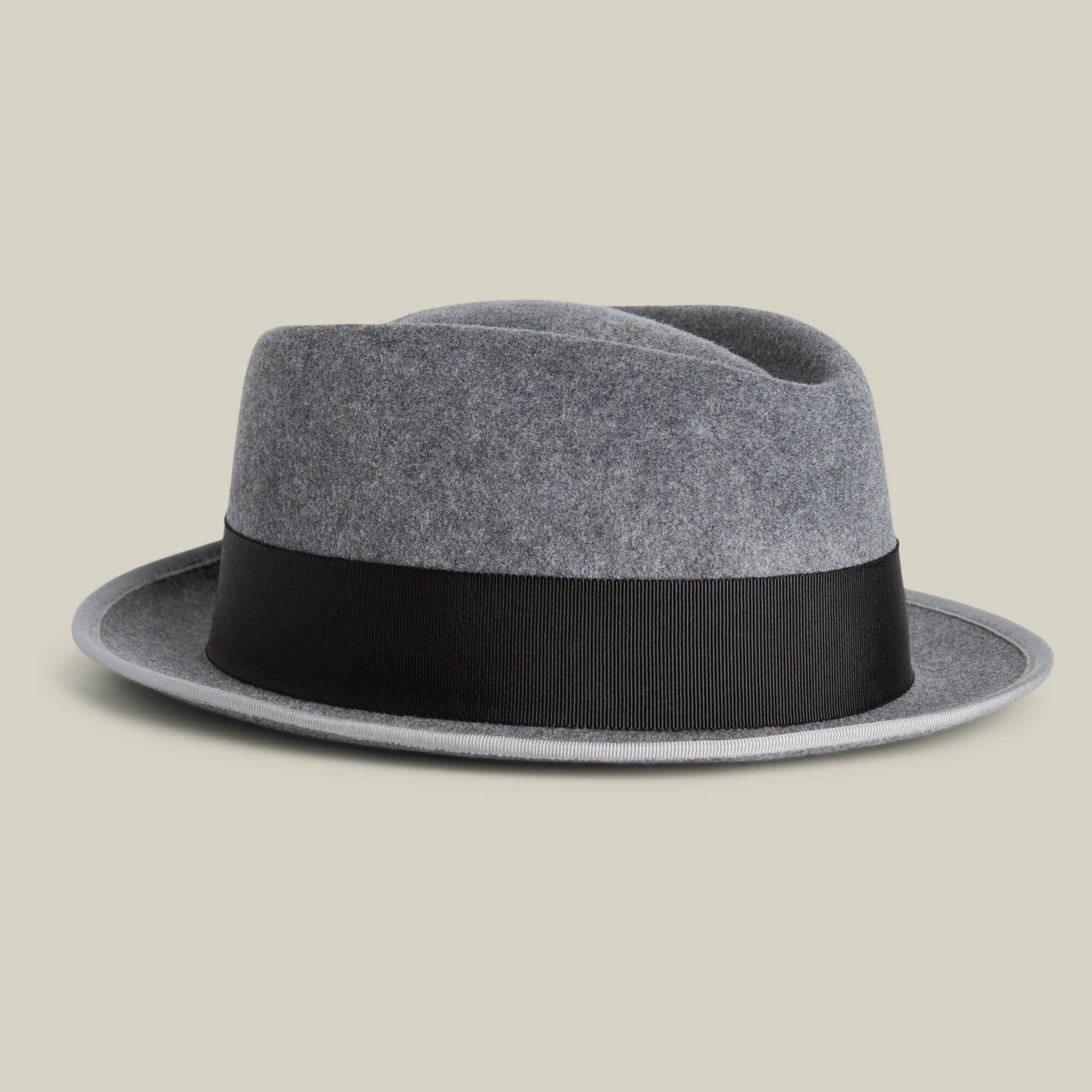 The Goorin Bros. Slick Carter is a gray wool short brim fedora with a black band, shown against a plain light background—ideal for capturing effortless style.
