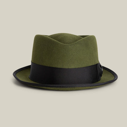 The Goorin Bros. Slick Carter is an olive green wool short brim fedora, featuring a wide black ribbon band and black-trimmed brim, shown against a plain beige background.