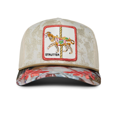 A beige Quid Glorier baseball cap by The Farm, featuring a mesh back, floral brim, and a front patch with a carousel animal and "STRUTTER". All sales final.