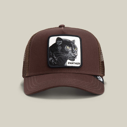Brown mesh trucker baseball hat by Goorin Bros., called The Panther, featuring a rectangular patch with an embroidered black panther and the word "PANTHER" on the front.