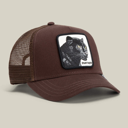 The Panther by Goorin Bros. is a brown mesh trucker baseball hat featuring a front patch with an embroidered black panther and the word "PANTHER.