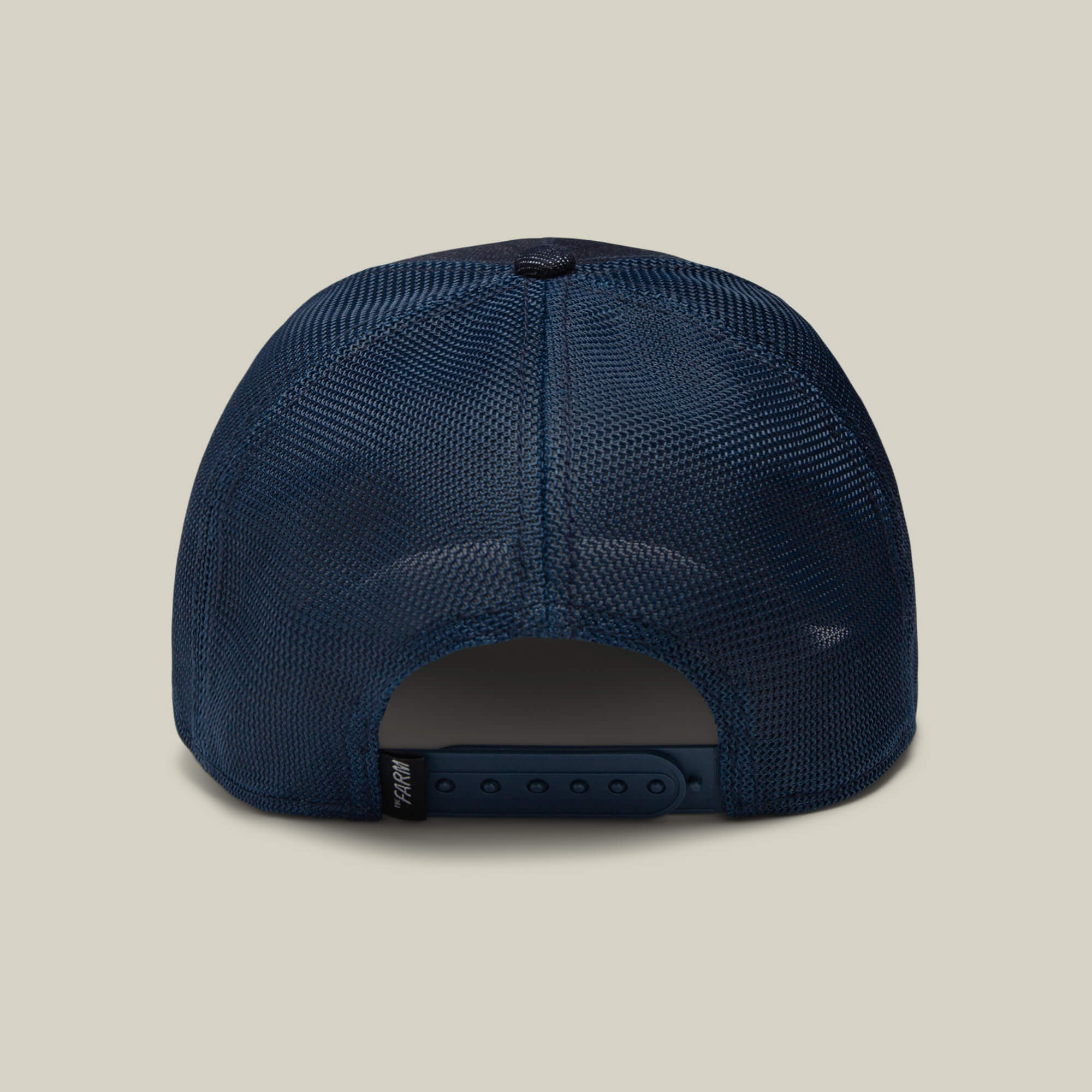 The Panther by Goorin Bros. is a navy blue mesh trucker baseball hat shown from the back, featuring a snapback closure, a small black tag on the adjustable strap, and subtle Ninja Kitten flair.