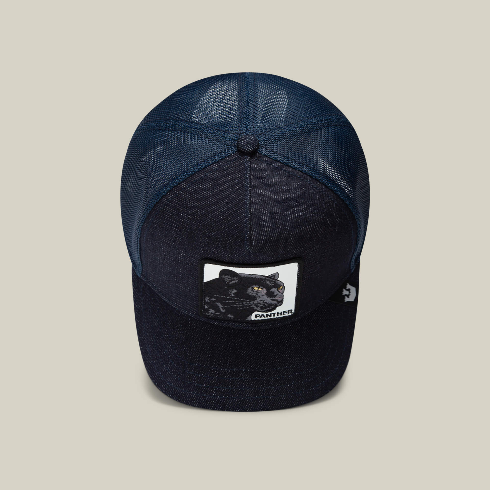 A dark blue mesh trucker baseball hat from Goorin Bros., called The Panther, featuring a front patch with two illustrated panthers and the label PANTHER.