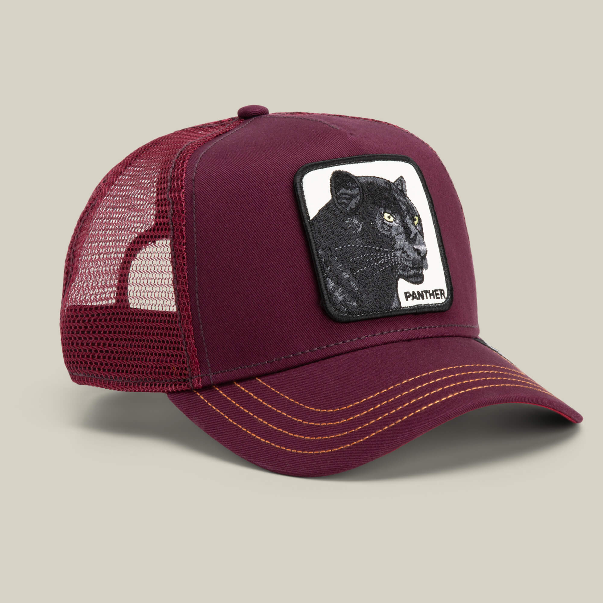 The Panther by Goorin Bros. is a maroon mesh trucker baseball hat with a front patch showing an embroidered black panther and the word PANTHER—ideal for fans of The Farm.