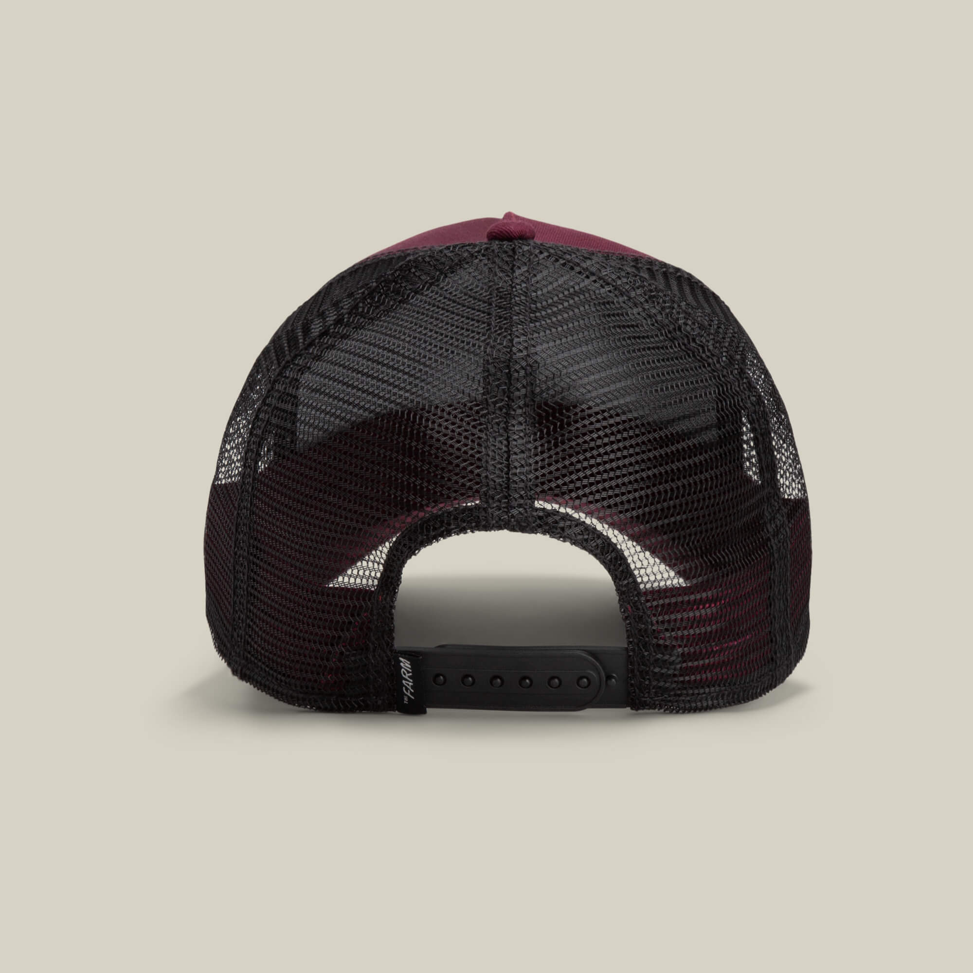 The Panther by Goorin Bros. is a maroon and black mesh-back trucker hat from The Farm collection, shown from the rear with an adjustable snapback closure, blending classic style and modern comfort.