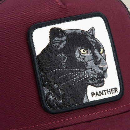 Close-up of The Panther trucker hat by Goorin Bros., showcasing a maroon design with a rectangular patch featuring an embroidered black panther and the word "PANTHER" in capital letters.