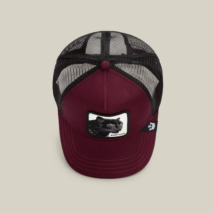 The Panther by Goorin Bros. is a burgundy trucker baseball hat with a black mesh back and a front patch featuring an embroidered black panther.