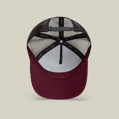 A maroon and black mesh trucker baseball hat, The Panther by Goorin Bros., shown from the inside with an adjustable snapback closure and branded inner lining.