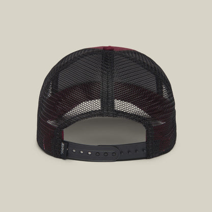 Back view of The Farm's "The Lone Wolf" black mesh trucker hat with adjustable snapback, perfect for independent spirits, shown against a plain background.