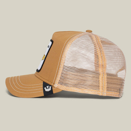 Side view of The Farm’s “The Queen Bee” brown and beige mesh trucker hat with flat bill, white stitching, front patch, and adjustable snapback—slay your style and wear your crown with confidence.