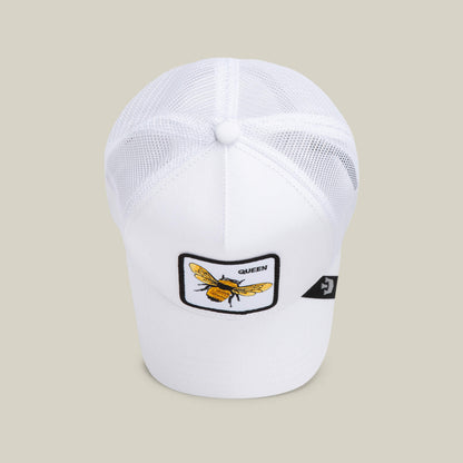 The Farm's "The Queen Bee" is a white mesh baseball cap with a front patch showing a yellow bee, the word "QUEEN," and a small crown.
