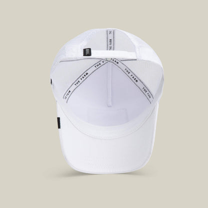 The Queen Bee baseball cap by The Farm is shown from above, highlighting its mesh back panels, interior sweatband, and branded crown taping with THE FARM text—an effortless style statement.