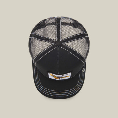 The Queen Bee by The Farm is a black mesh trucker hat with white stitching and a front rectangular embroidered patch featuring a bird graphic—a standout accessory for every look.