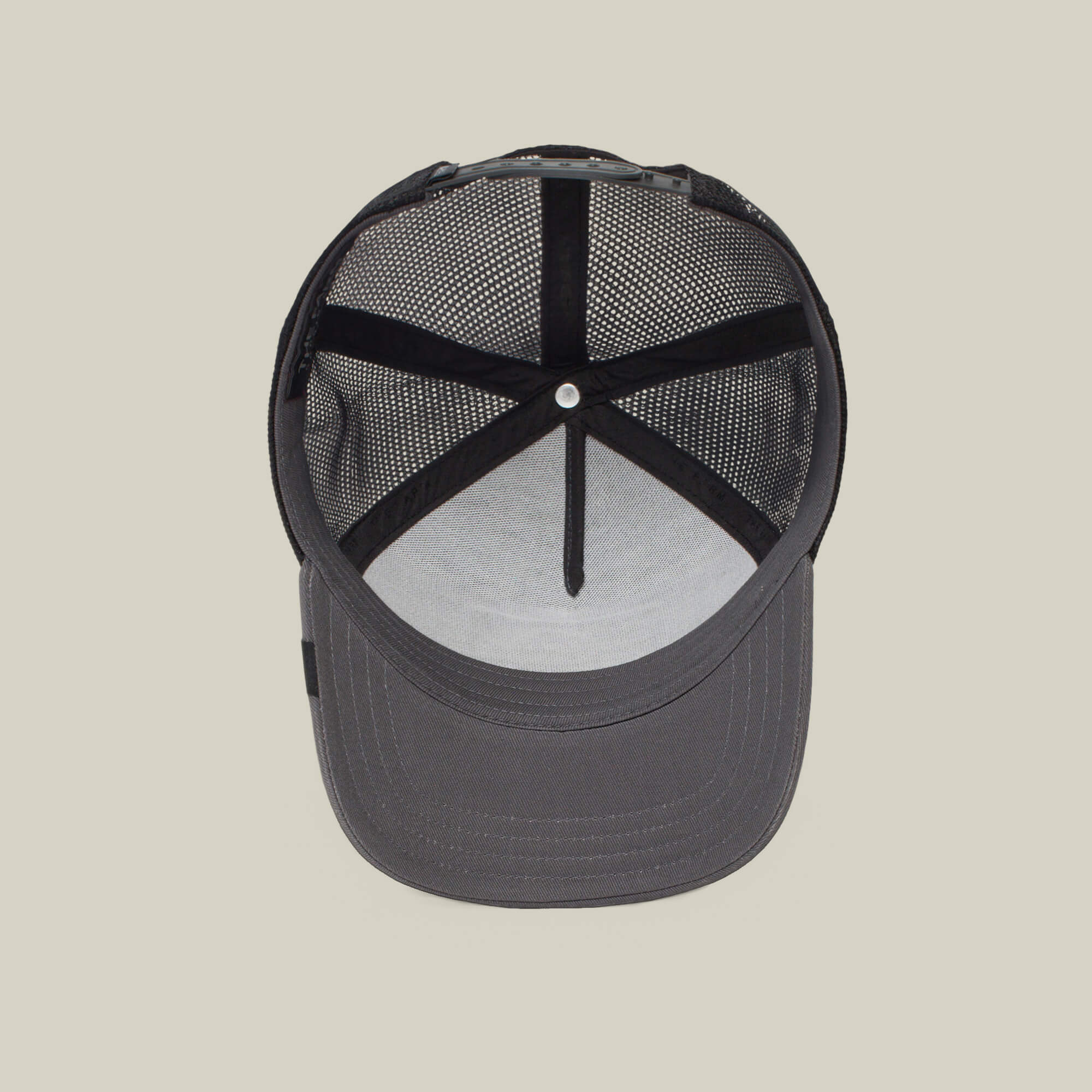 The Boss by The Farm is a black mesh trucker cap featuring interior lining, mesh back panels, and an adjustable strap. Add to cart for standout style wherever you go.