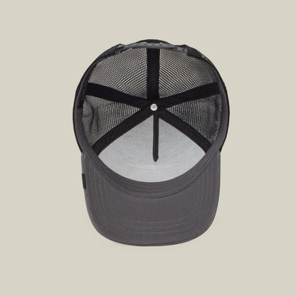 The Boss by The Farm is a black mesh trucker cap featuring interior lining, mesh back panels, and an adjustable strap. Add to cart for standout style wherever you go.