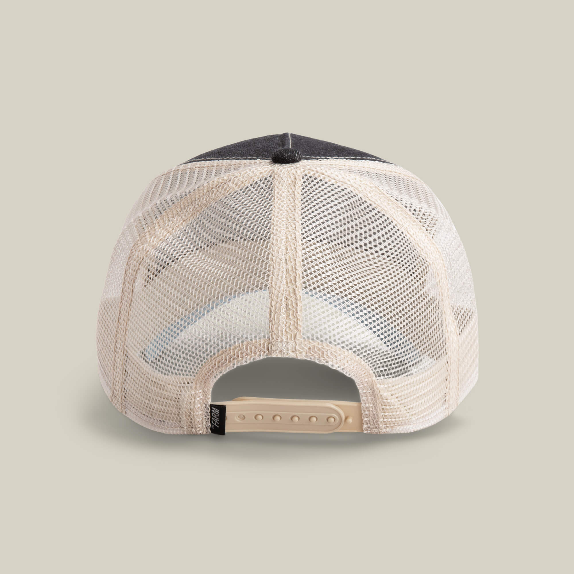 The back view of The Boss mesh trucker hat by The Farm is shown, featuring a beige adjustable snapback closure, ready to Add to cart against a plain light background.