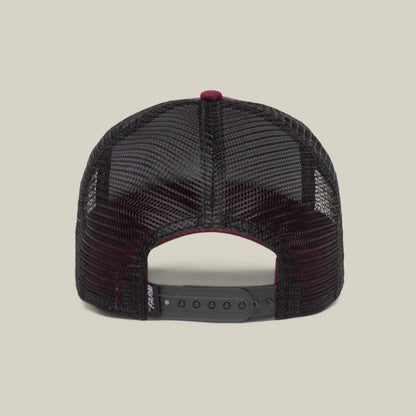 The image shows the back view of The Boss, a black mesh trucker hat by The Farm, featuring an adjustable snapback—ideal for your next movie theater outing.