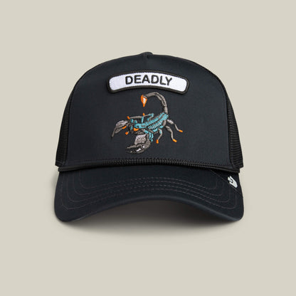 The Goorin Bros. GB2 Deadly Scorp trucker hat features a matte black crown, a scorpion patch with "DEADLY" above the embroidery, and a breathable mesh back for sleek, bold style.