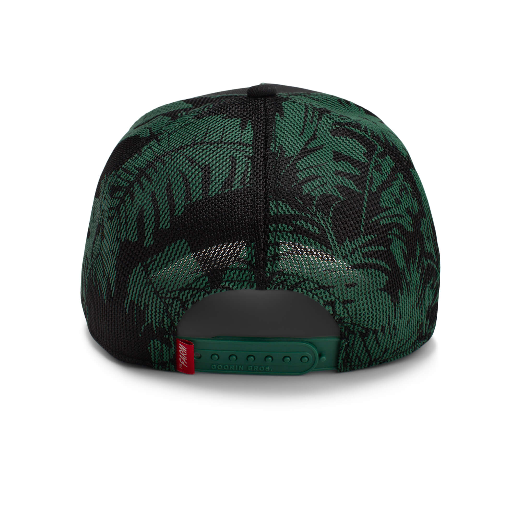 Back view of The Farm's Slash snapback cap in black and green with a leaf pattern, adjustable strap, and red tag. All sales final.
