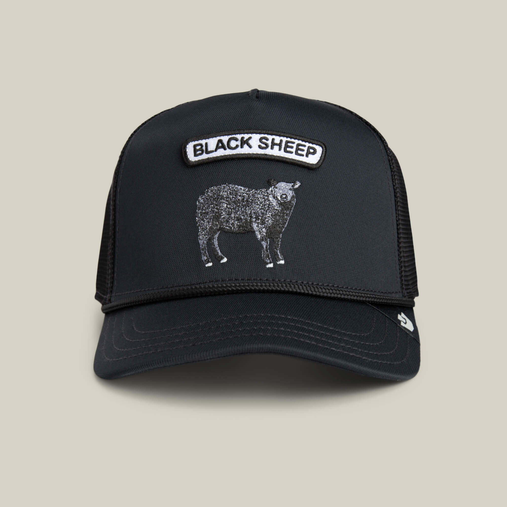 The Farm's GB2 Black Sheep trucker hat features a BLACK SHEEP patch above an illustrated sheep, shown on a plain light background—a perfect pick for fans of custom mods or finely tuned engine spirit.