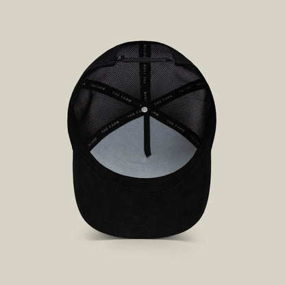 A view of The Suede Spider by Goorin Bros. from the inside, highlighting mesh panels and a fabric strip labeled THE FARM—an ideal funny dad gift.