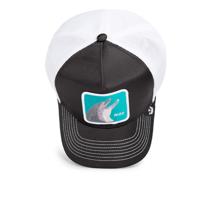 The Rizzky Bizznizz by Goorin Bros. is a black and white trucker hat with a mesh back and a front patch featuring a dolphin and the word RIZZ on turquoise, making it a bold statement piece.