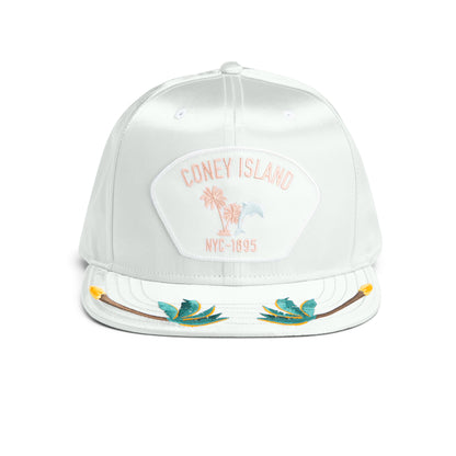 The Goorin Bros. Island Getaway snapback in Sky features a Coney Island NYC-1895 and palm tree patch, inspired by the boardwalk, plus tropical leaf embroidery on the brim.