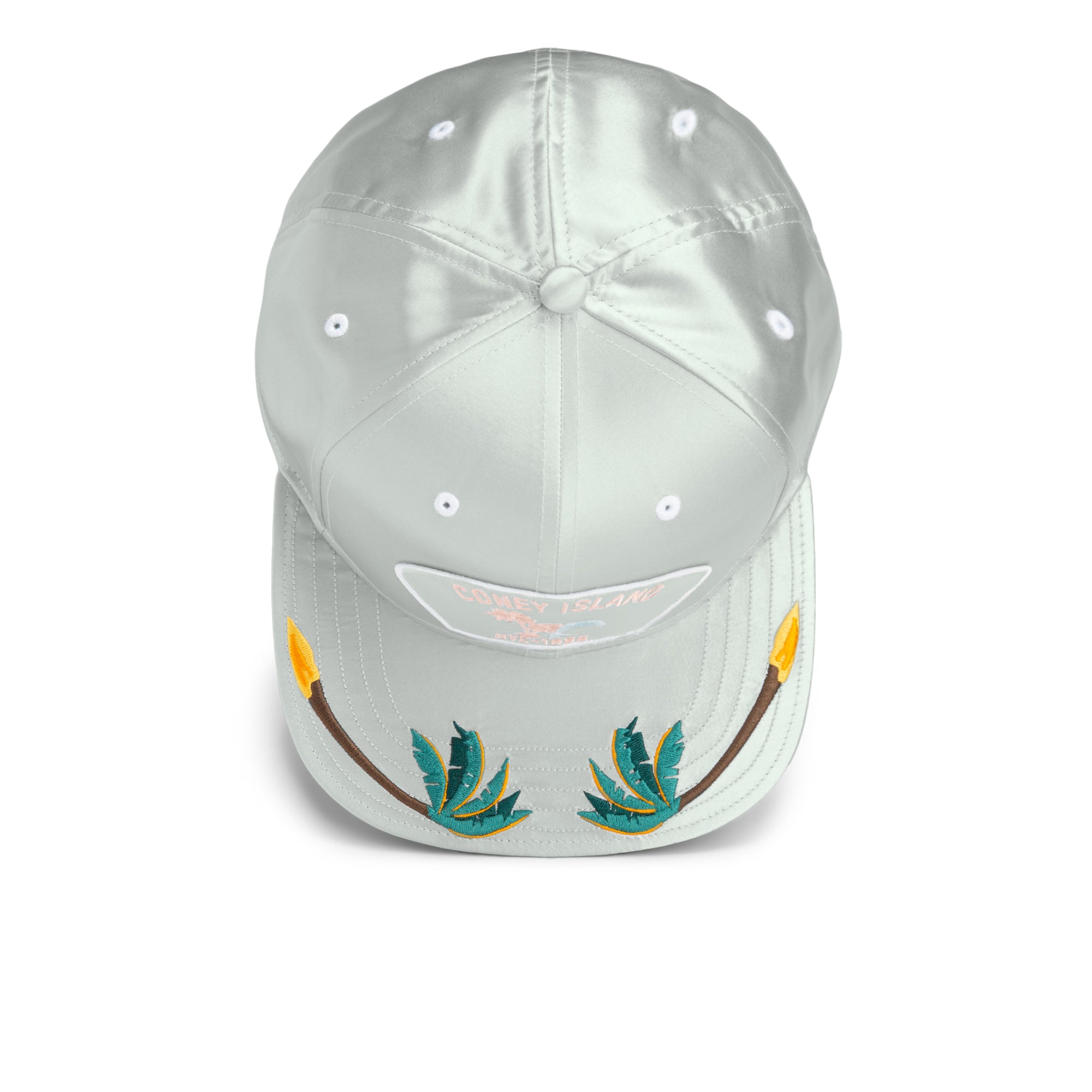 The Goorin Bros. Island Getaway cap features a light gray design inspired by NYC’s Coney Island boardwalk, with embroidered green leaves and yellow-tipped spears on the brim.