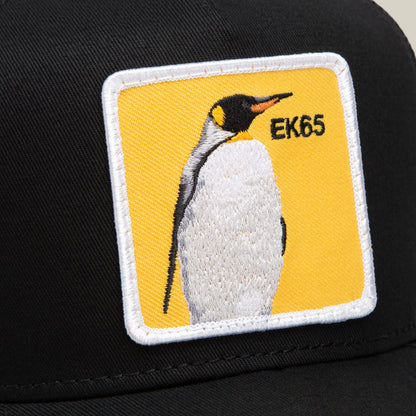 The EK65 Penguin by Goorin Bros. is a black hat with a rectangular yellow patch showing an embroidered standing penguin and "EK65" text in the upper right—a must-have limited drop for collectors.