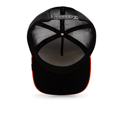 The Farm Shell Smoke trucker cap features black mesh, an adjustable snapback closure, white inner lining, and a curved brim with an orange edge. Please note all sales are final.