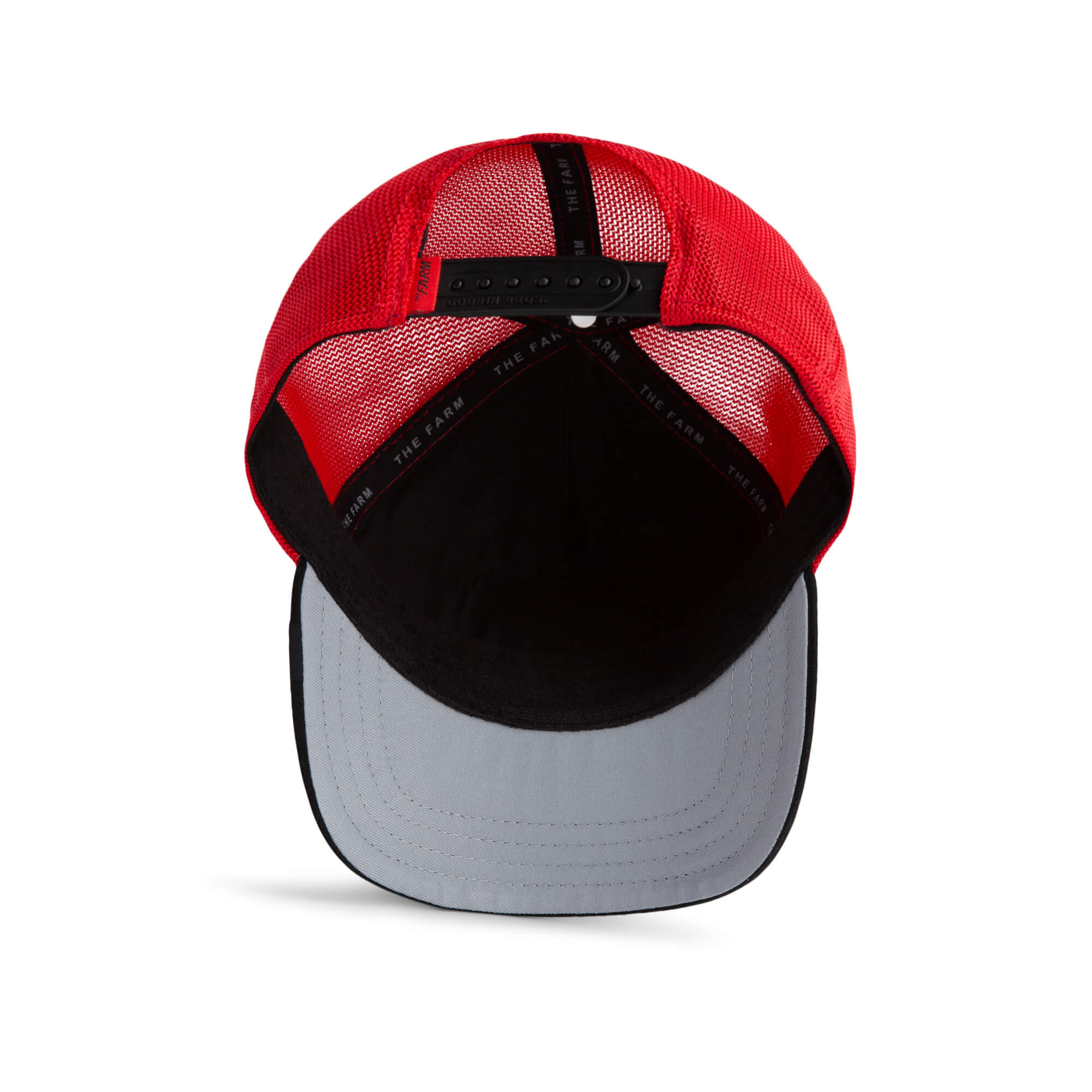 A red and black mesh trucker hat by The Farm, "TF is Bustle?", shown from the inside with a black adjustable strap and gray curved brim. All Sales Are Final.
