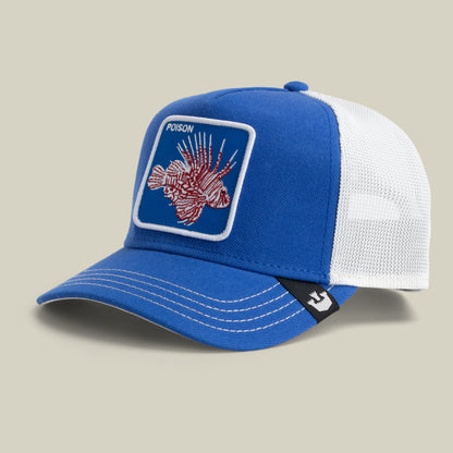 The Farm Lionfish Heat mesh trucker hat features blue and white colors, a lionfish patch with "POISON" embroidered above it. All sales are final.