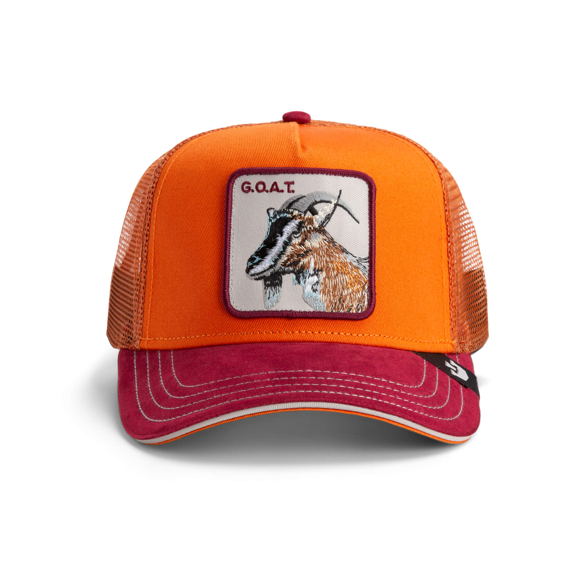 Front view of The Farm’s Greatest Grazer, an orange and red trucker hat with mesh back and a patch featuring a goat and G.O.A.T. text. All sales are final.