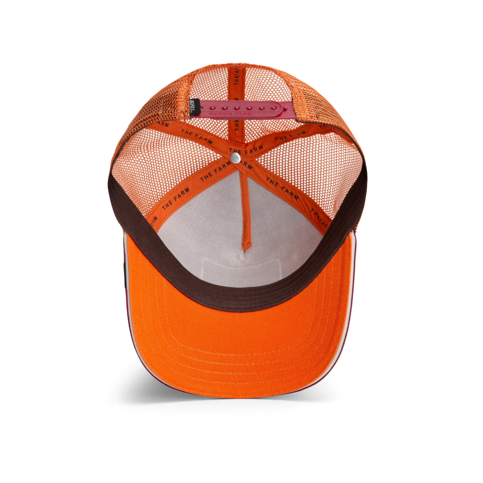 The Farm's Greatest Grazer orange trucker hat features a mesh back, adjustable strap, and interior details as seen from above. All sales are final.
