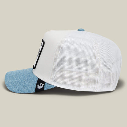 A side view of the Goorin Bros. Rooster Fan Institution Ball Club hat, featuring a light denim crown, blue denim brim, white mesh back, and a black and white front patch—your game-day essential.